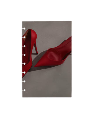 A single discbound dashboard depicting an image of a pair of red high-heeled shoes on a gray background.