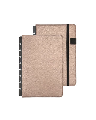 Rose gold leather planner cover for discbound planners, with a black elastic ribbon over a white background.