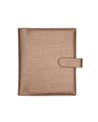 Rose gold vegan leather planner cover for discbound panners over a white background.