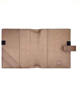 Rose gold vegan leather planner cover for discbound panners over a white background.
