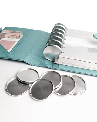 Sea Glass color leather discbound planner cover with silver binding discs.