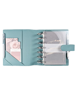 Light blue planner with a rose design on a white background