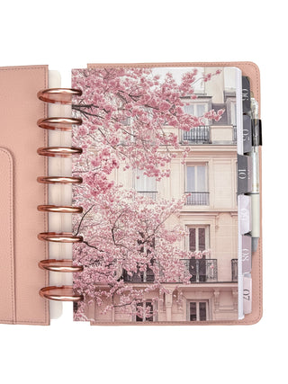 Pink cherry blossoms design on a planner with Rose Gold discs and Blush Vegan Leather Cover. 