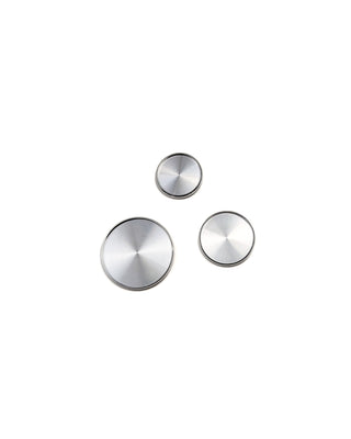 Three silver circular objects in different sizes on a white background.
