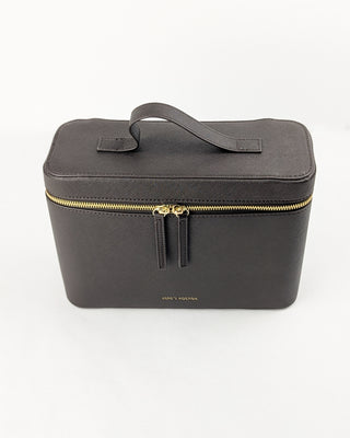 Chocolate brown vegan leather train case with top handle and gold metal hardware.
