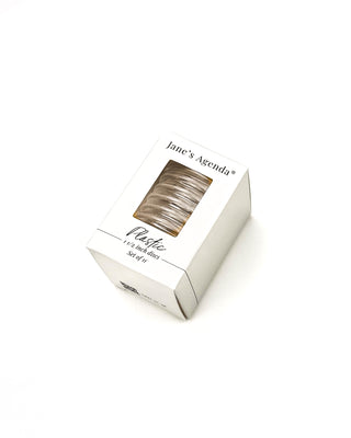 Box of Jane's Agenda plastic planner binding discs on a white background