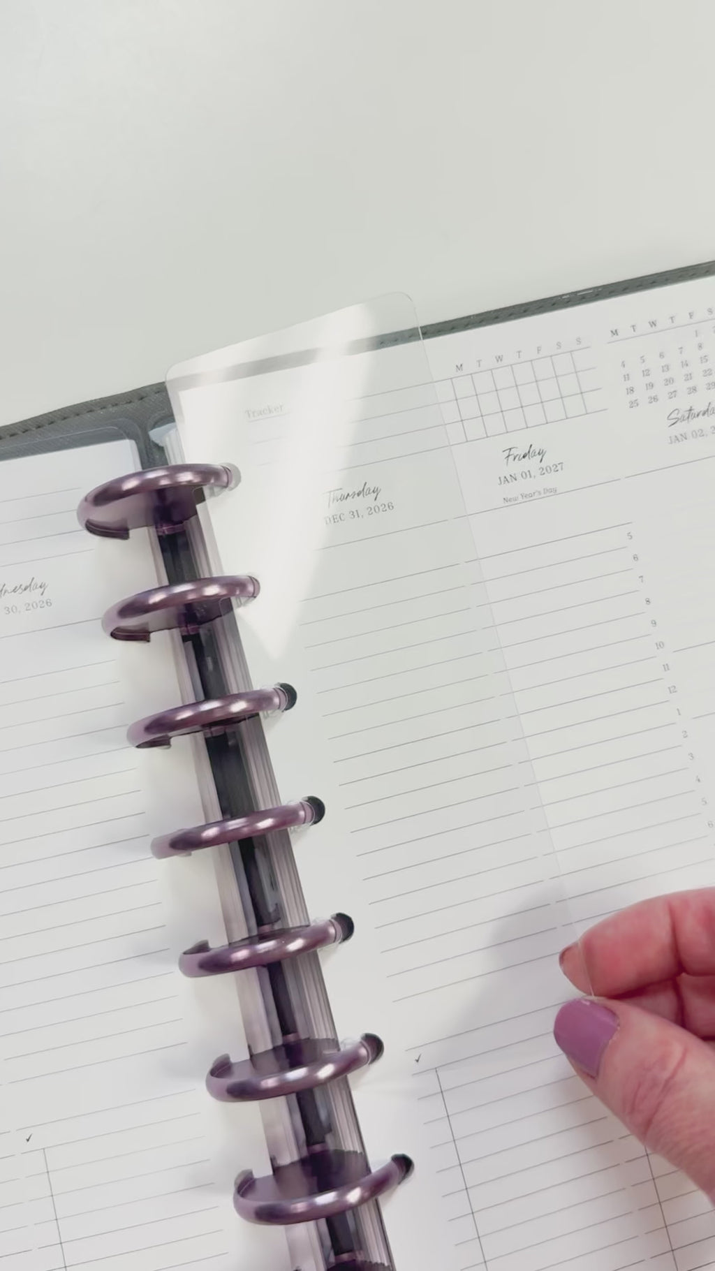 Cler plastic discbound page finder in a disc planner.