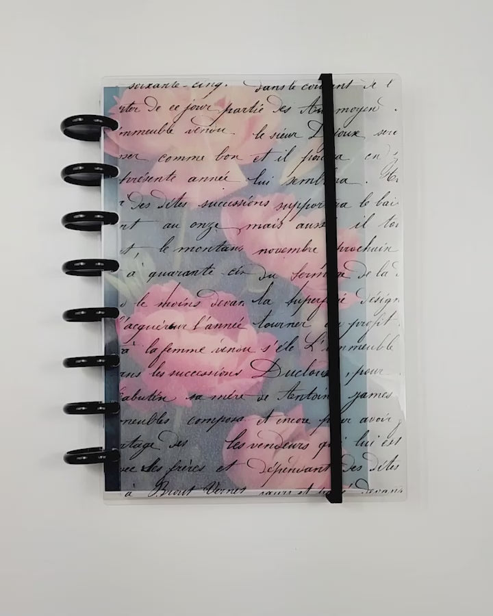 Discbound planner cover by Janes Agenda with elastic ribbon to keep your planner pages secure.