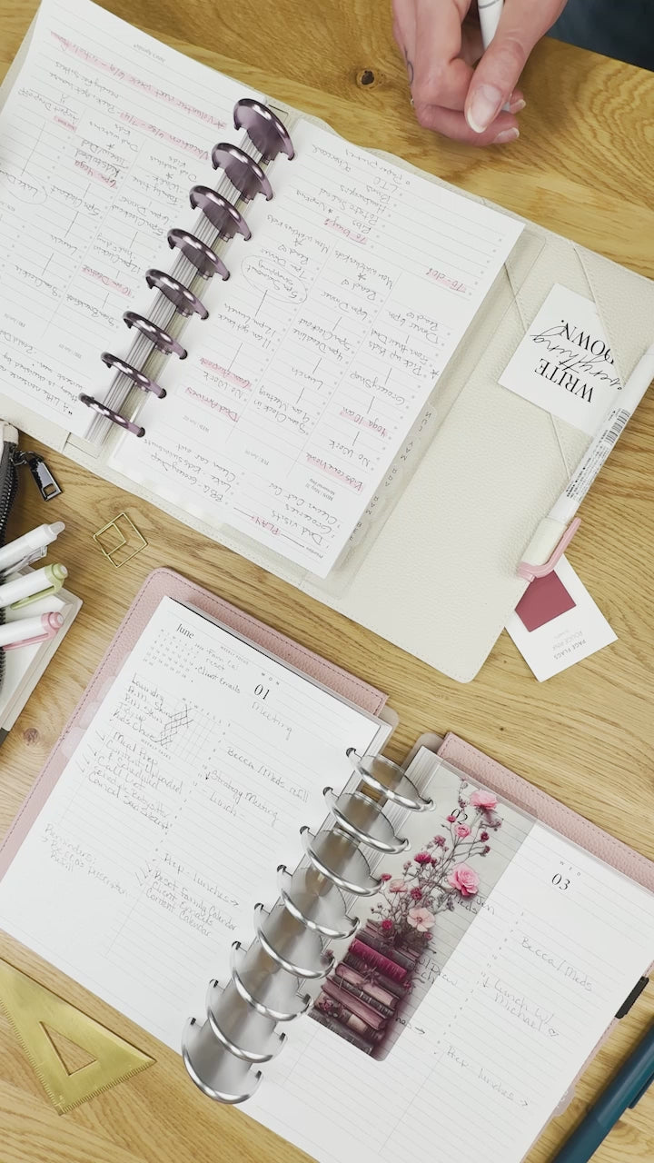 overhead view of planners on a desktop with planner inserts and other accessories