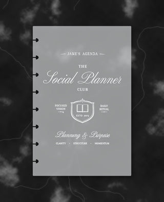 Frosted discbound planner dashboard featuring “The Social Planner Club” in white lettering with a planner crest and the phrases “Focused Vision,” “Daily Ritual,” and “Planning & Purpose,” displayed against a dark marble background.
