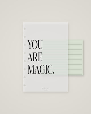 Frosted discbound planner dashboard featuring the phrase “YOU ARE MAGIC.” in large black lettering, layered over a pale green lined page.