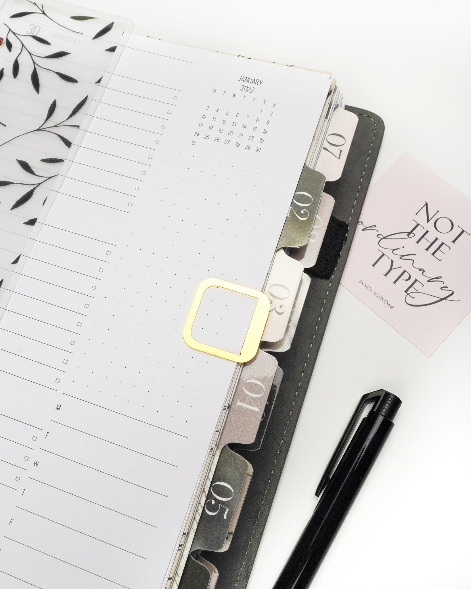This Jane's Agenda exclusive page marker fits right  into your discbouond or six ring planner pages.