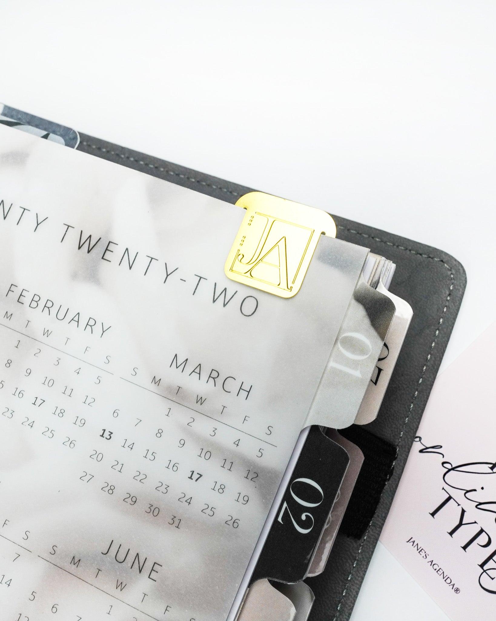 This Jane's Agenda exclusive page marker fits right  into your discbouond or six ring planner pages.