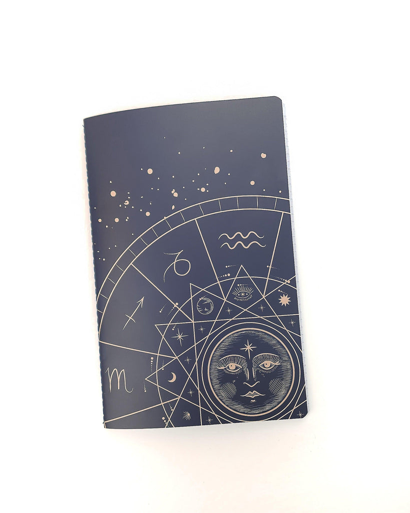 Paperback lined notebook journal with a zodiac sun cover by Jane's Agenda.