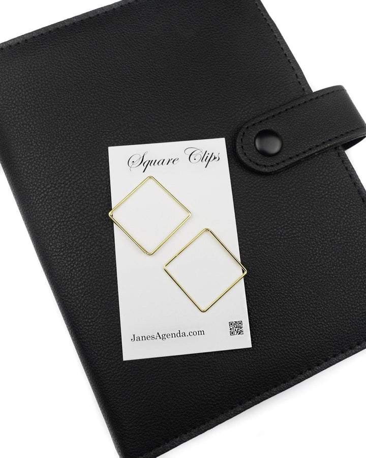 Square paper clips in a gold color for discbound and six ring planner by Jane's Agenda.