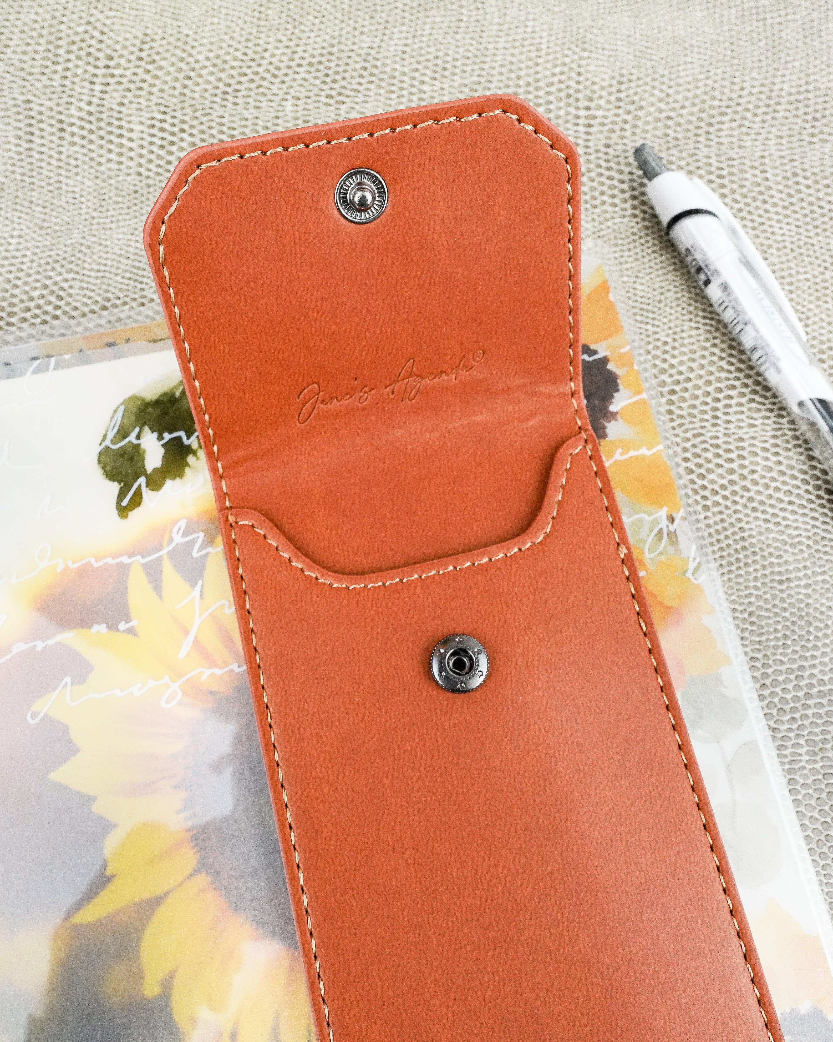 Snap pen pouch with elastic planner ribbon to fit over discbound and six ring planners and planner binding systems by Jane's Agenda®.