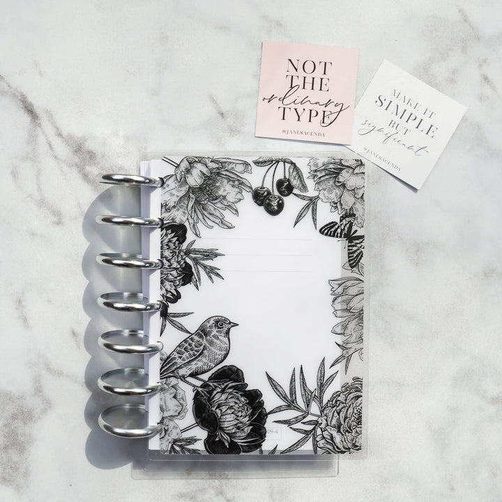 Lace Vellum Planner Cover by Jane's Agenda® over a disc-bound planner system with metal aluminum binding discs in silver