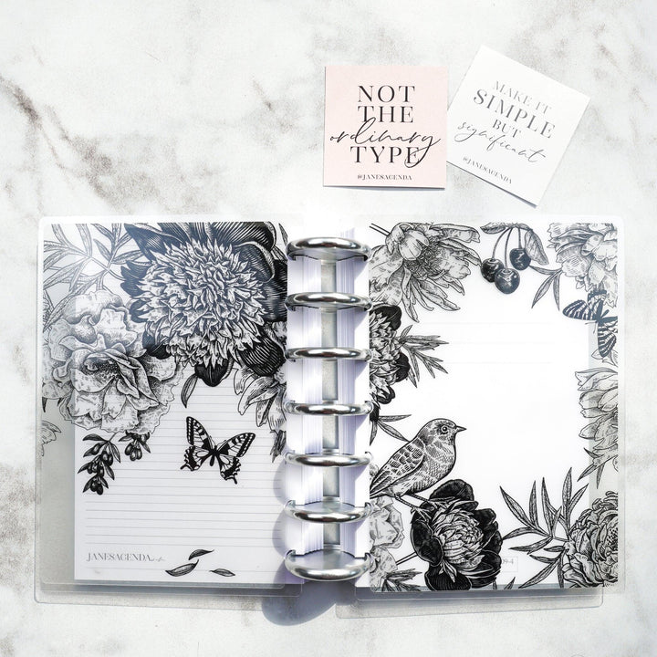 Lace Vellum Planner Cover by Jane's Agenda® on a disc-bound planner system with silver metal binding discs.
